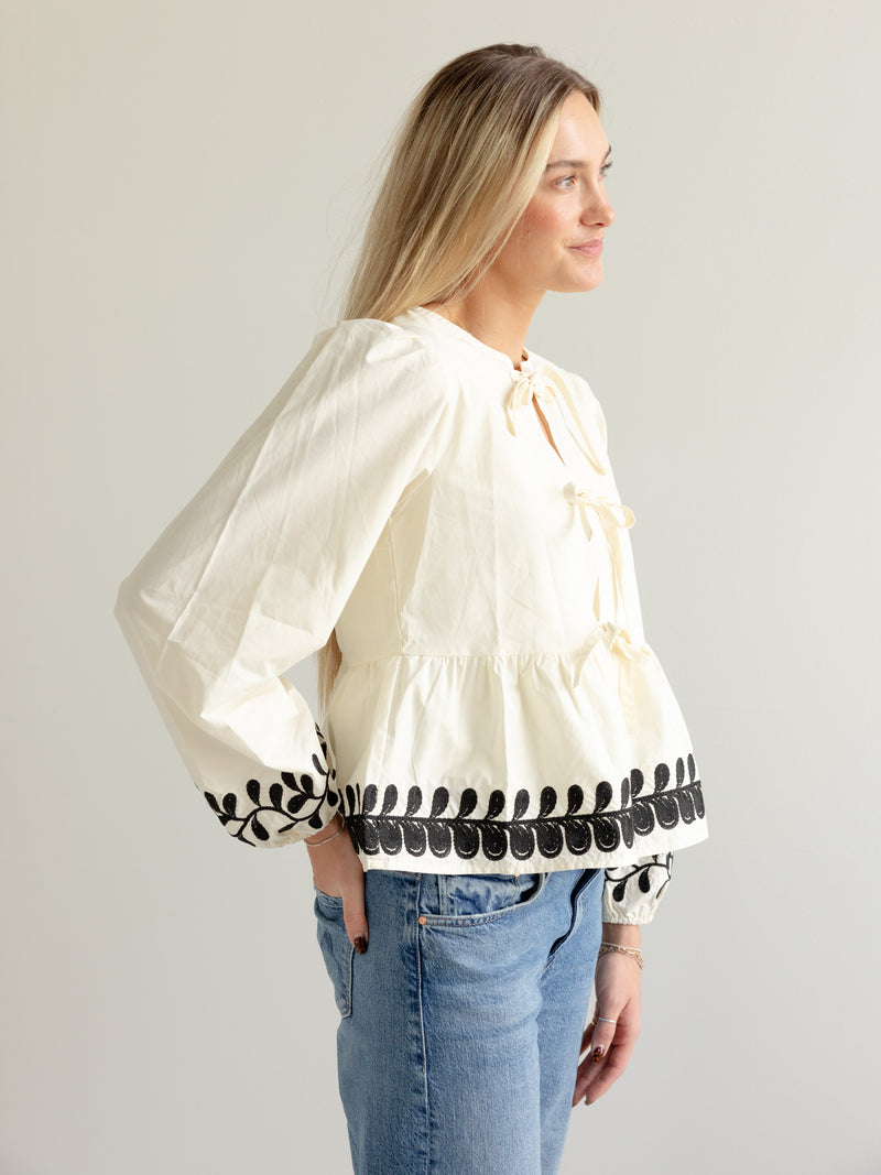 Embroidered Peplum Bow Blouse